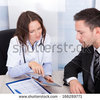 Thumb stock photo young female doctor showing digital tablet to businessman 166289771